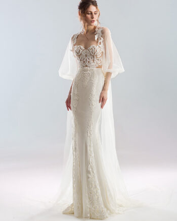 Front view of a strapless wedding dress with a fitted lace bodice and a bishop sleeve tulle cape, decorated with matching lace embroidery. Available at Papilio Boutique's sample sale in Toronto.