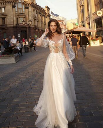 Bishop sleeve A-line wedding dress with illusion neckline and lace detailing on the bodice