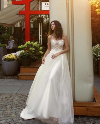 A-line wedding gown with a nude sweetheart bodice and ivory embroidery