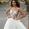 A-line wedding gown with a nude sweetheart bodice and ivory embroidery