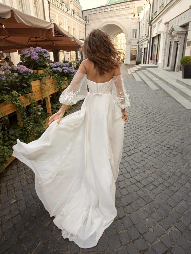 Chiffon wedding dress with off-the-shoulder bishop sleeves and high leg slit