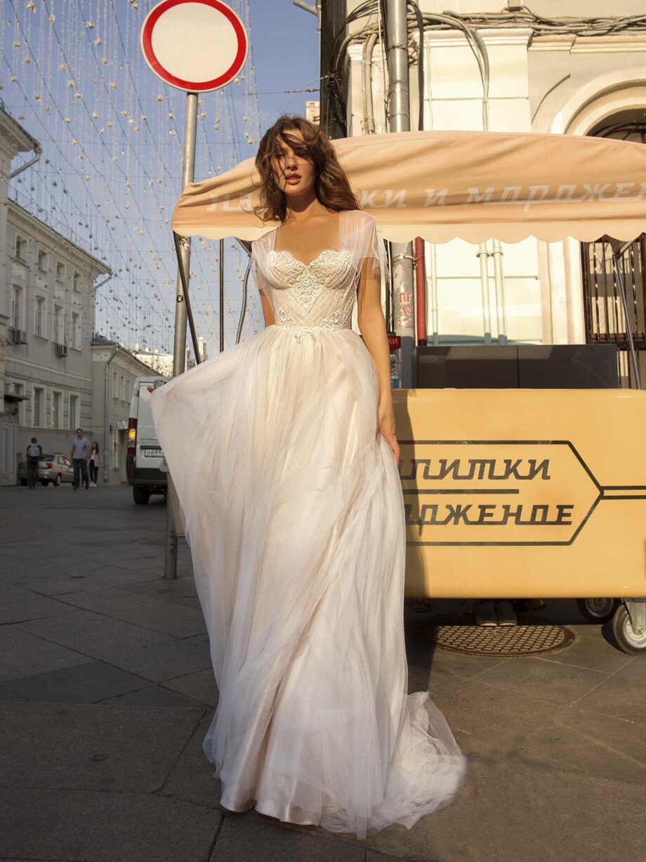 A-line wedding gown with butterfly sleeves and embroidered sweetheart bodice