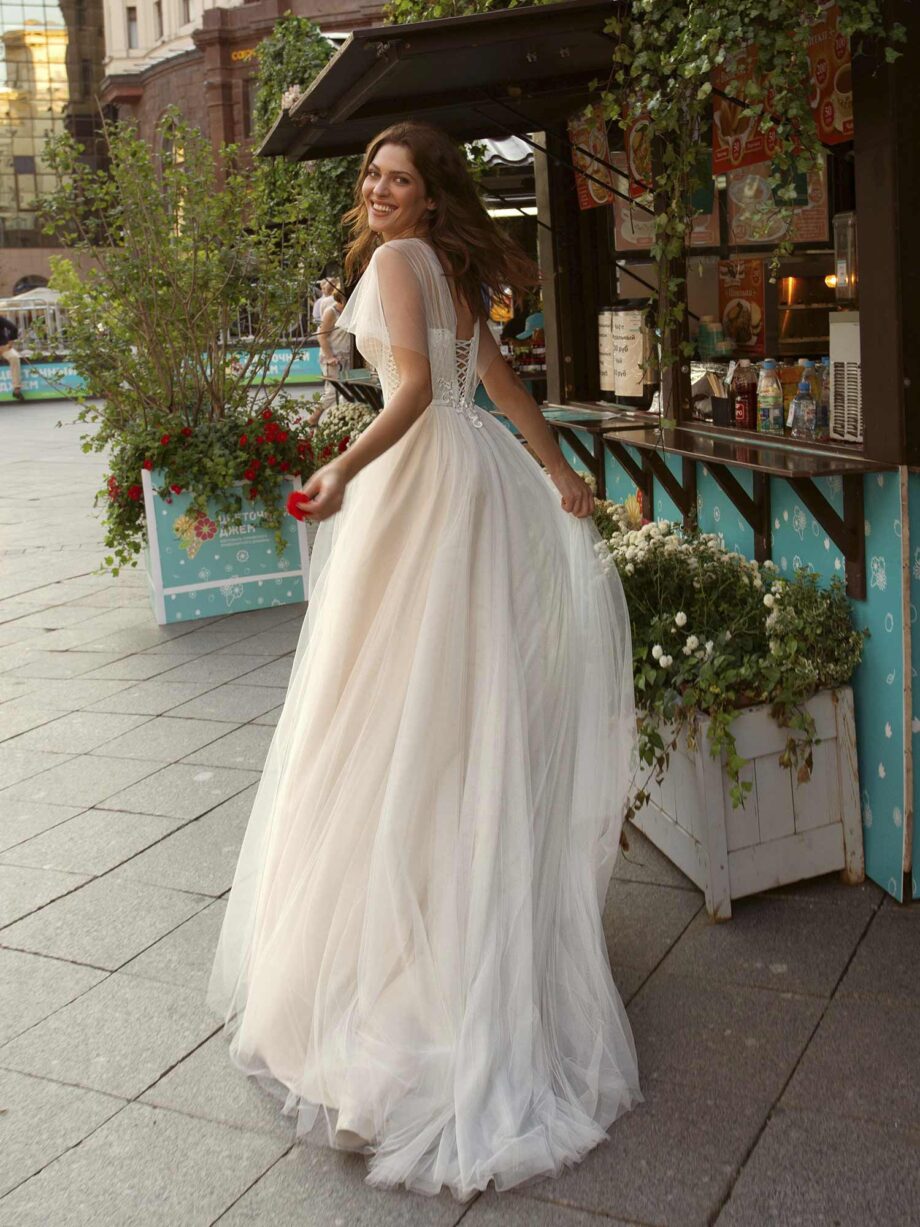 A-line wedding gown with butterfly sleeves and embroidered sweetheart bodice