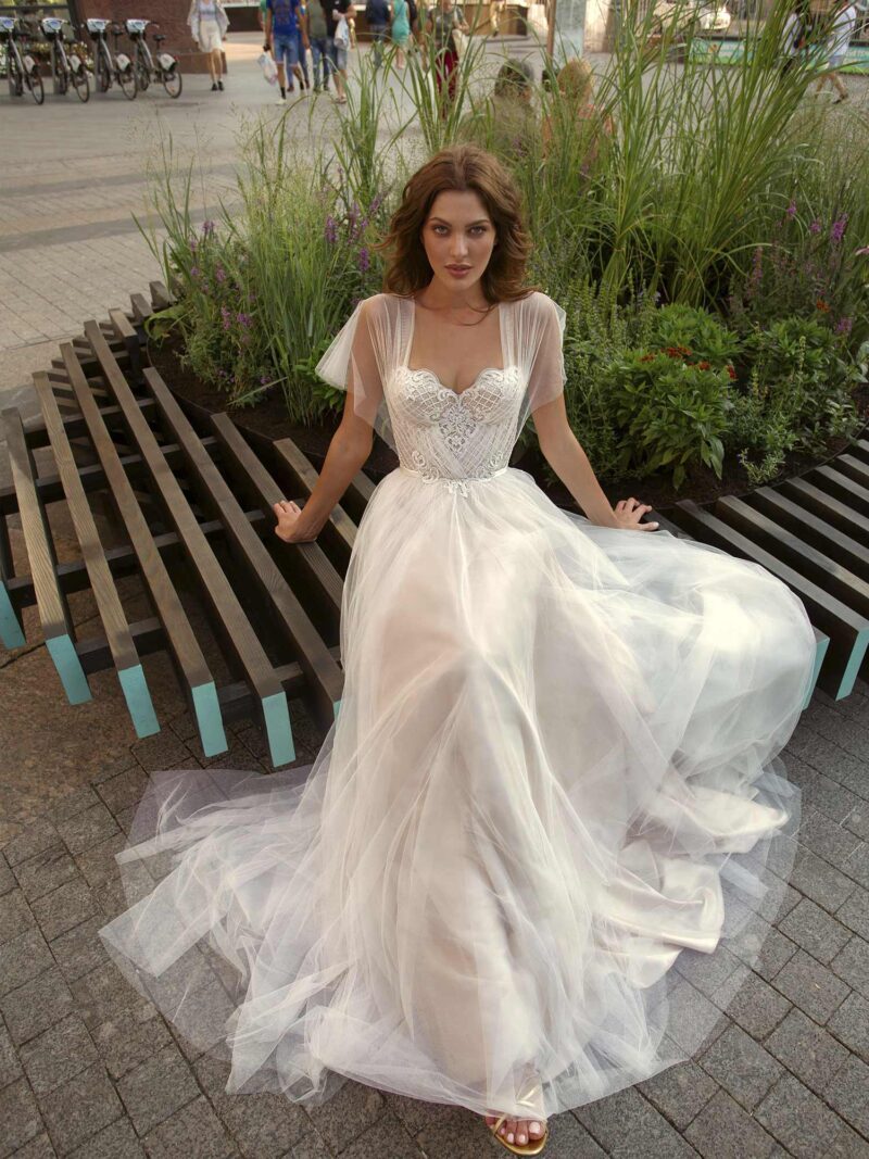 A-line wedding gown with butterfly sleeves and embroidered sweetheart bodice