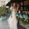 A-line wedding gown with butterfly sleeves and embroidered sweetheart bodice