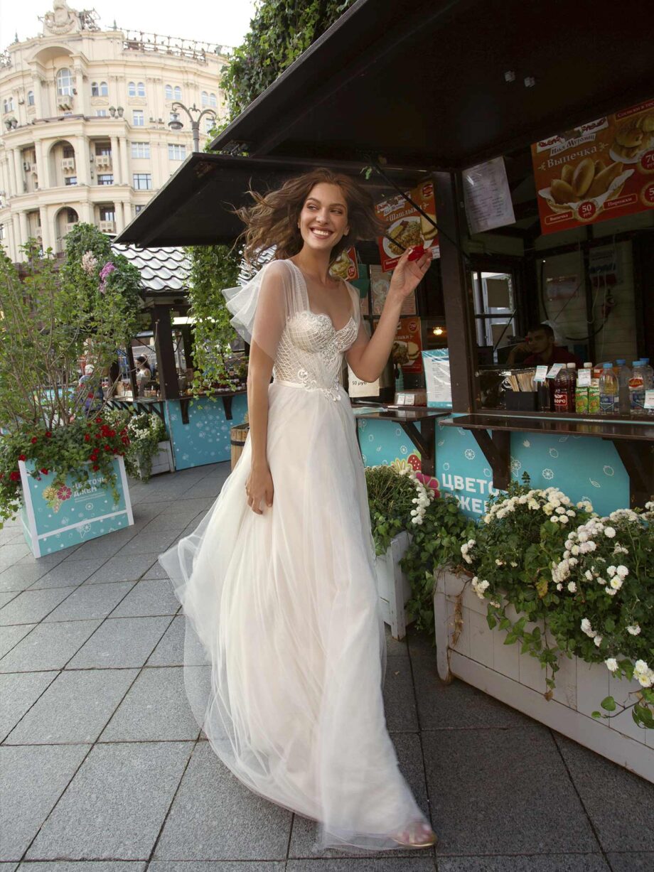 A-line wedding gown with butterfly sleeves and embroidered sweetheart bodice