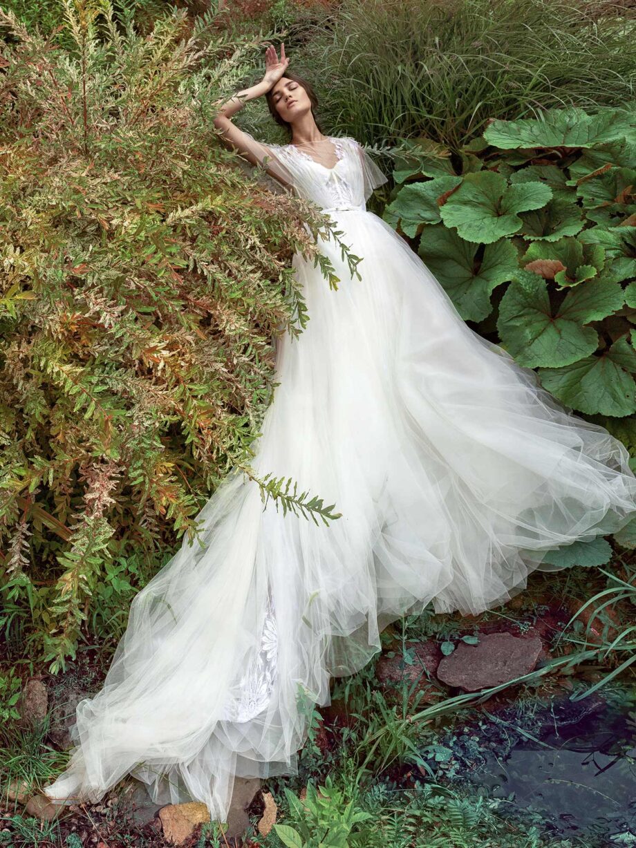 Butterfly sleeved A-line wedding dress with bustier bodice