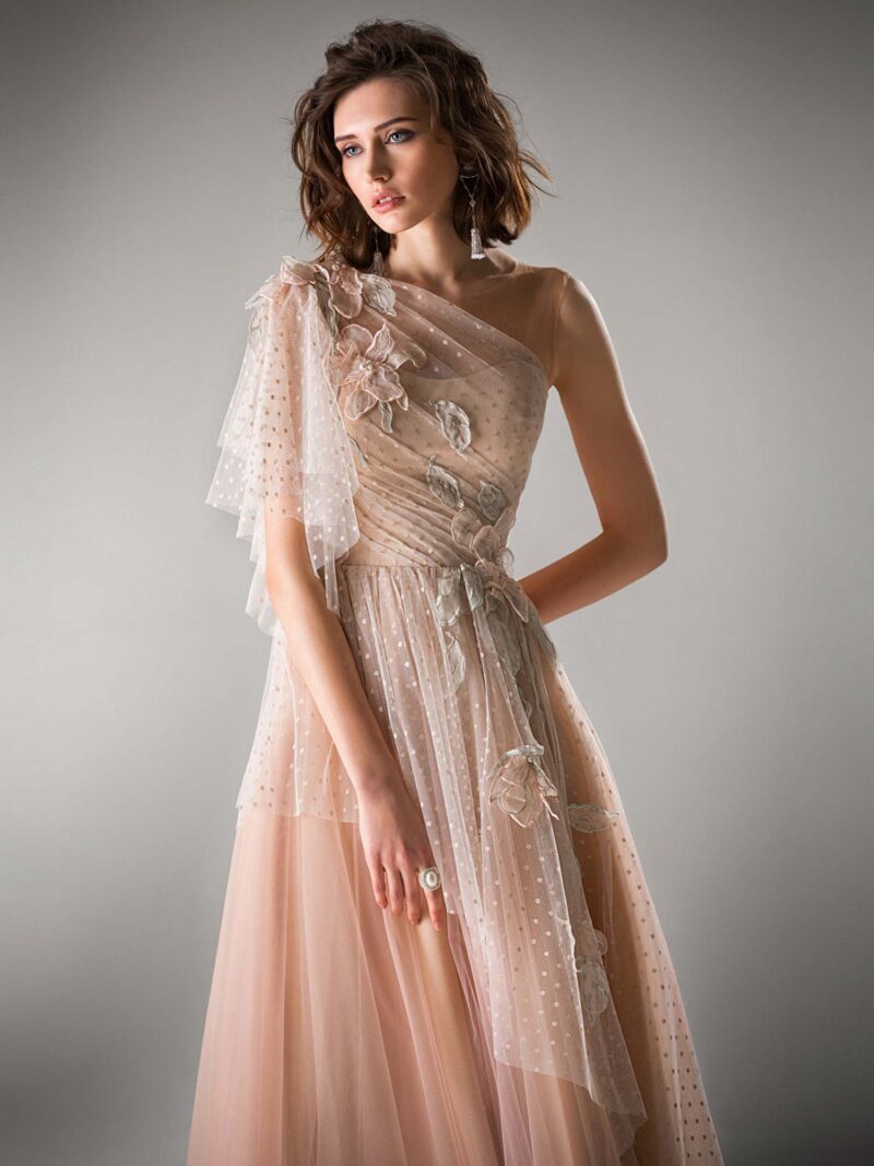 Tulle evening gown with one shoulder sleeve