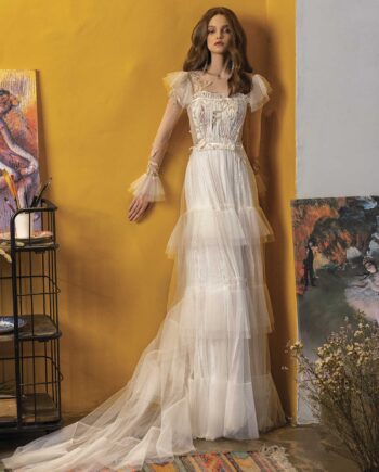 Wedding dress with long sleeves and ruffled skirt