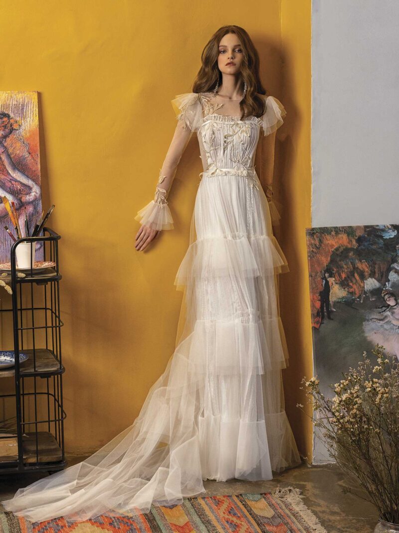 Wedding dress with long sleeves and ruffled skirt