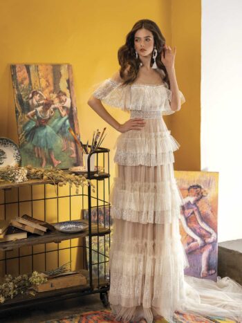 A-line wedding dress with off-the-shoulder neckline and ruffled layers