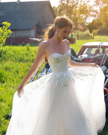 Wedding dress with bustier bodice and floral embroidery