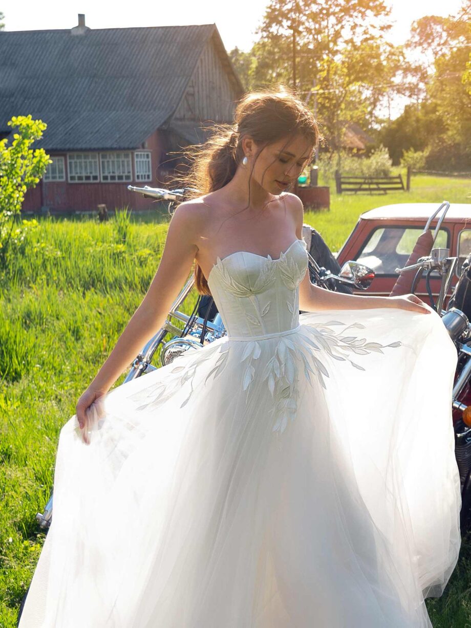 Wedding dress with bustier bodice and floral embroidery