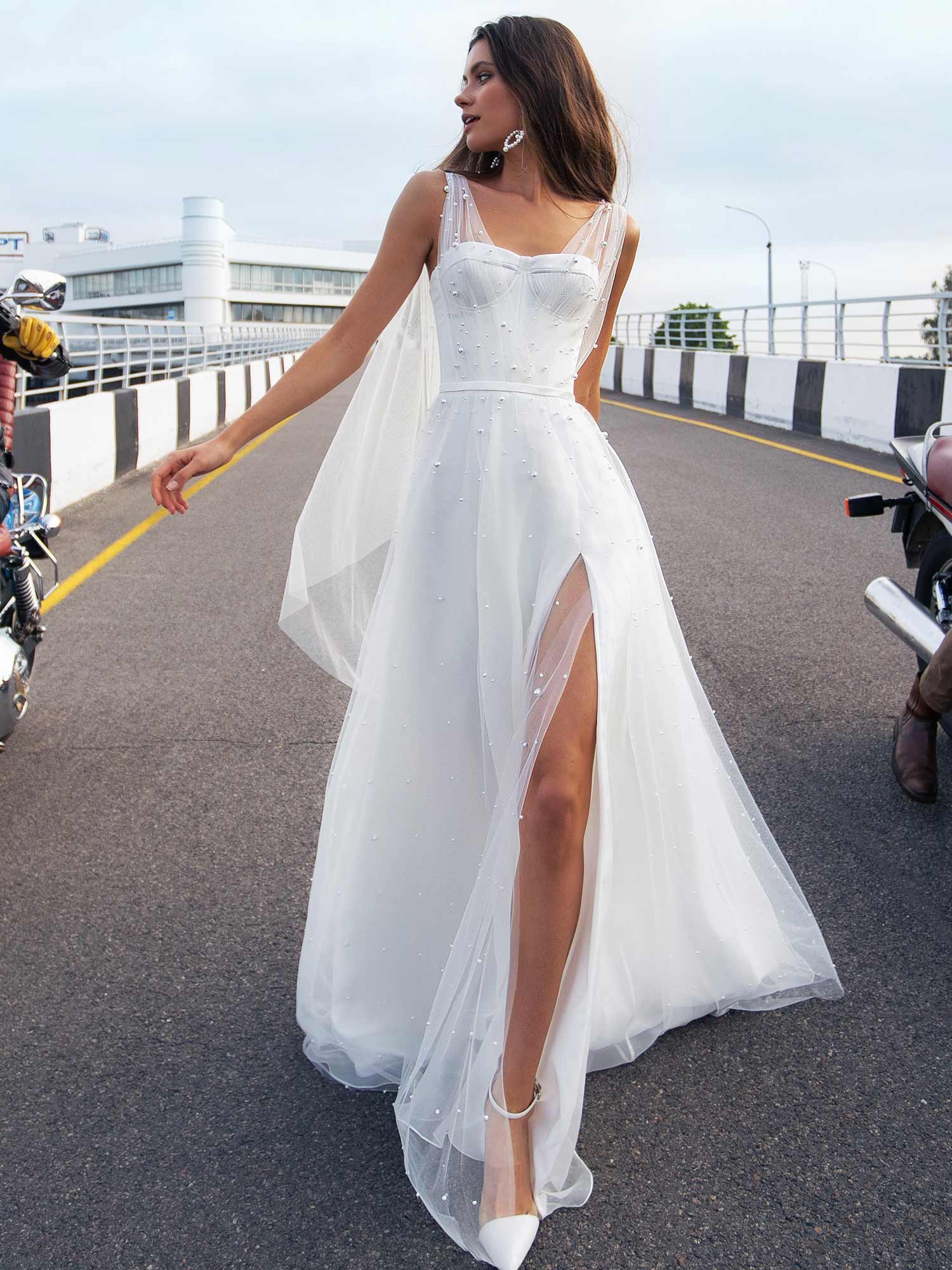 Bridal Gown With Pearl Embellishments And Cape Sleeves