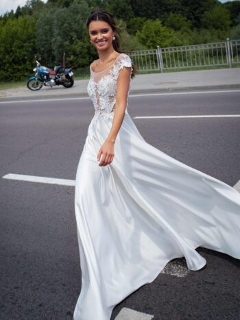 Bridal gown with cap sleeves and embroidery