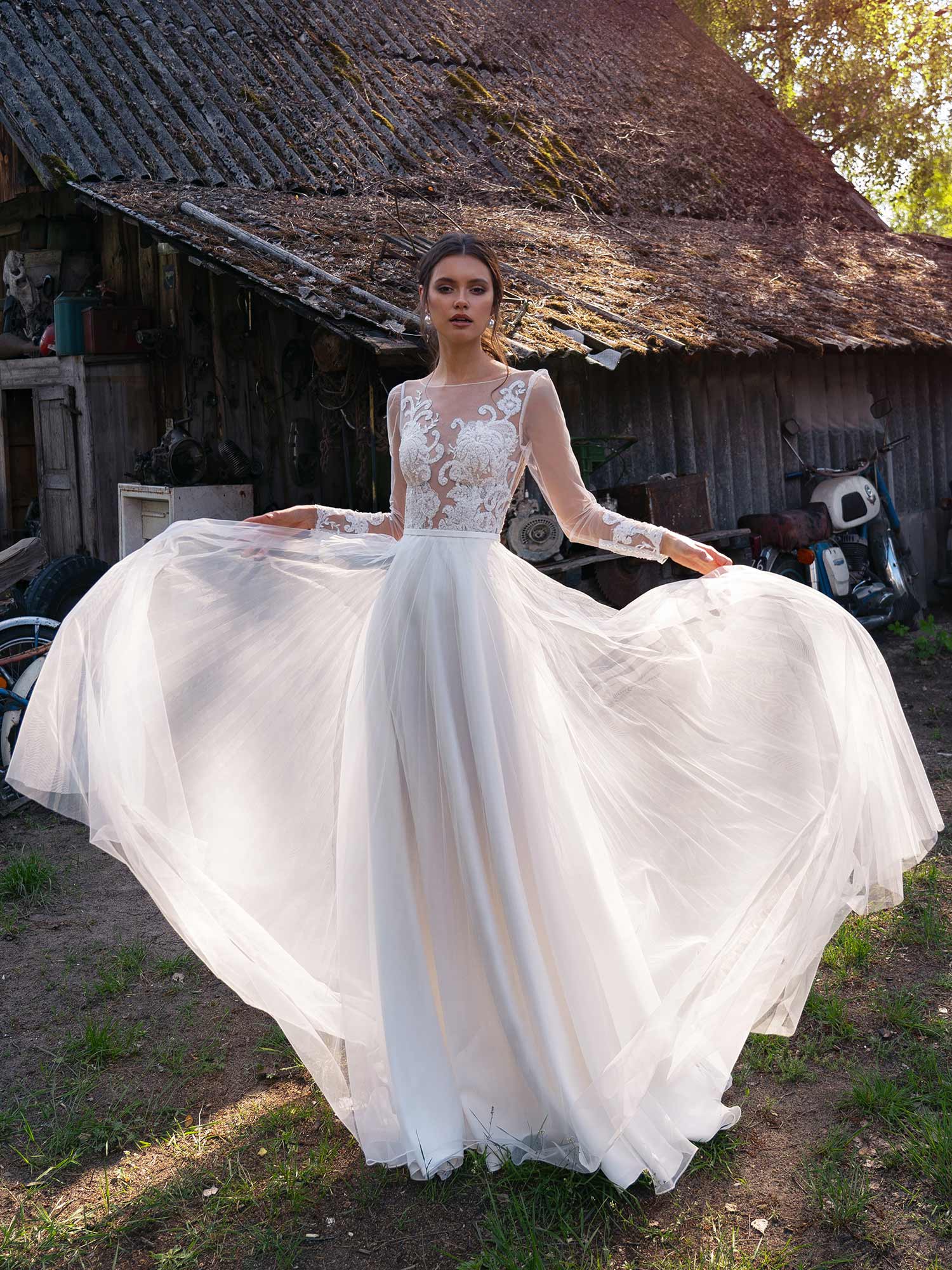 Illusion long-sleeved wedding dress with embroidery