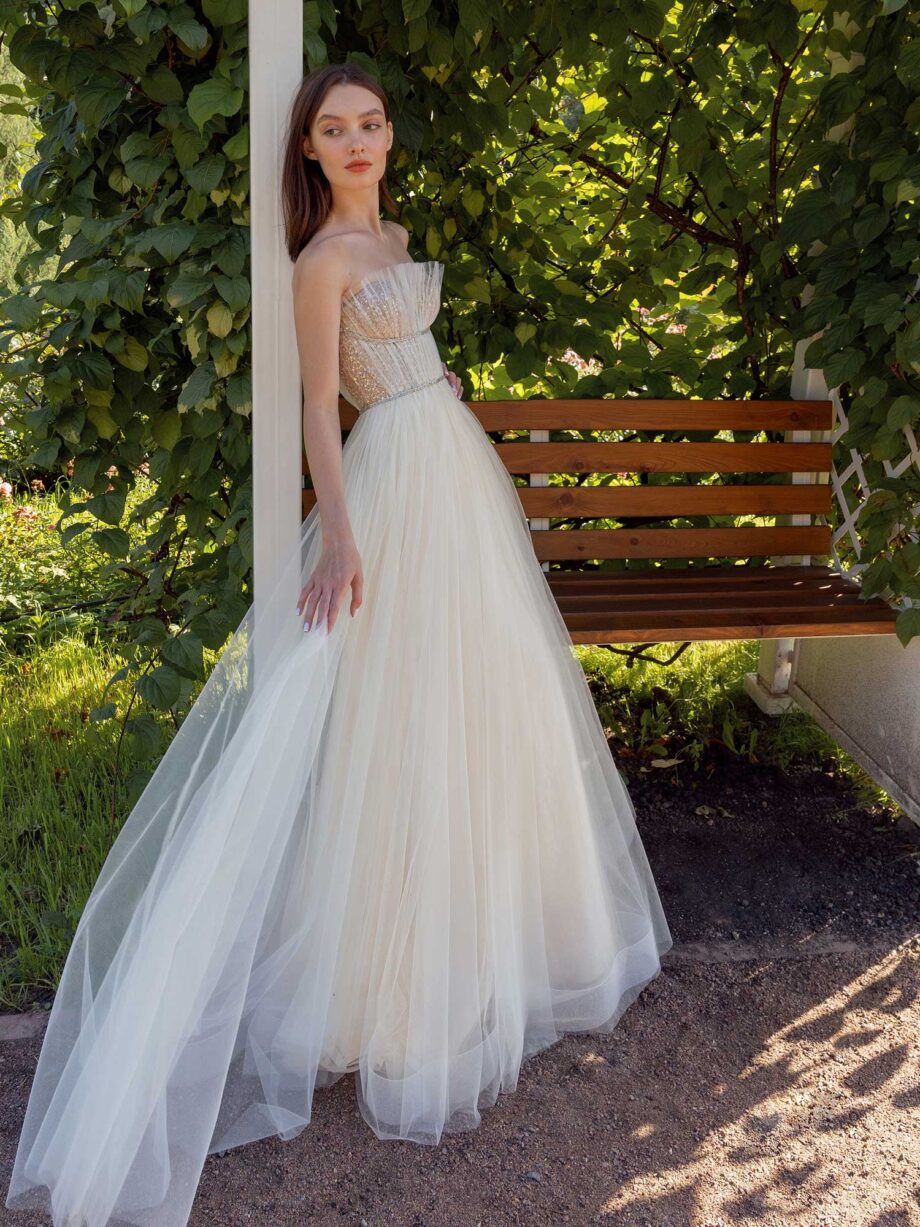 Strapless A-line wedding dress with frilled tulle neckline and sequined bodice