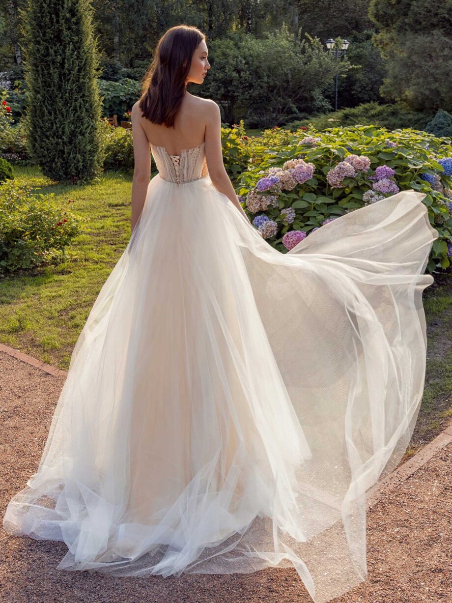 Strapless A-line wedding dress with frilled tulle neckline and sequined bodice