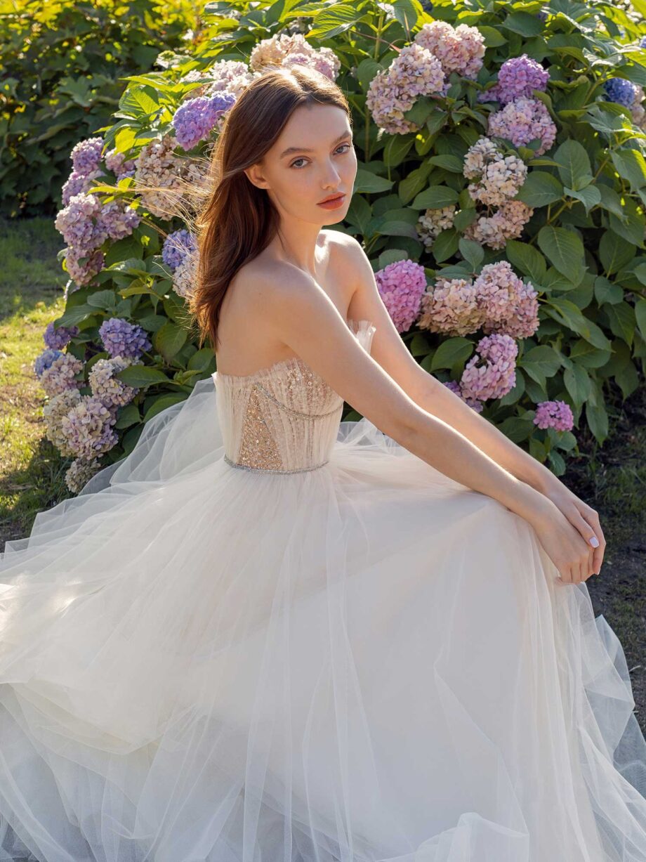 Strapless A-line wedding dress with frilled tulle neckline and sequined bodice