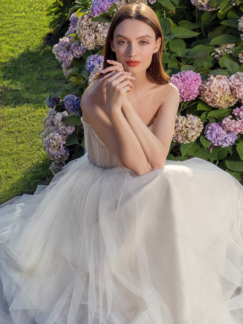 Strapless A-line wedding dress with frilled tulle neckline and sequined bodice