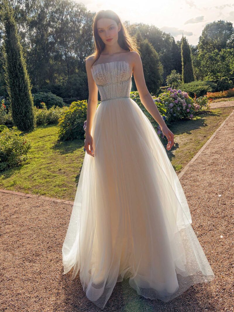 Strapless A-line wedding dress with frilled tulle neckline and sequined bodice