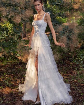 Shimmering ball gown with textured skirt and high slit