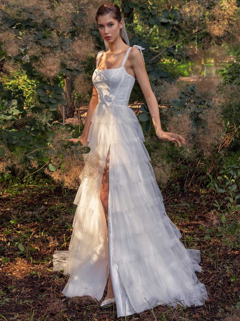 Shimmering ball gown with textured skirt and high slit