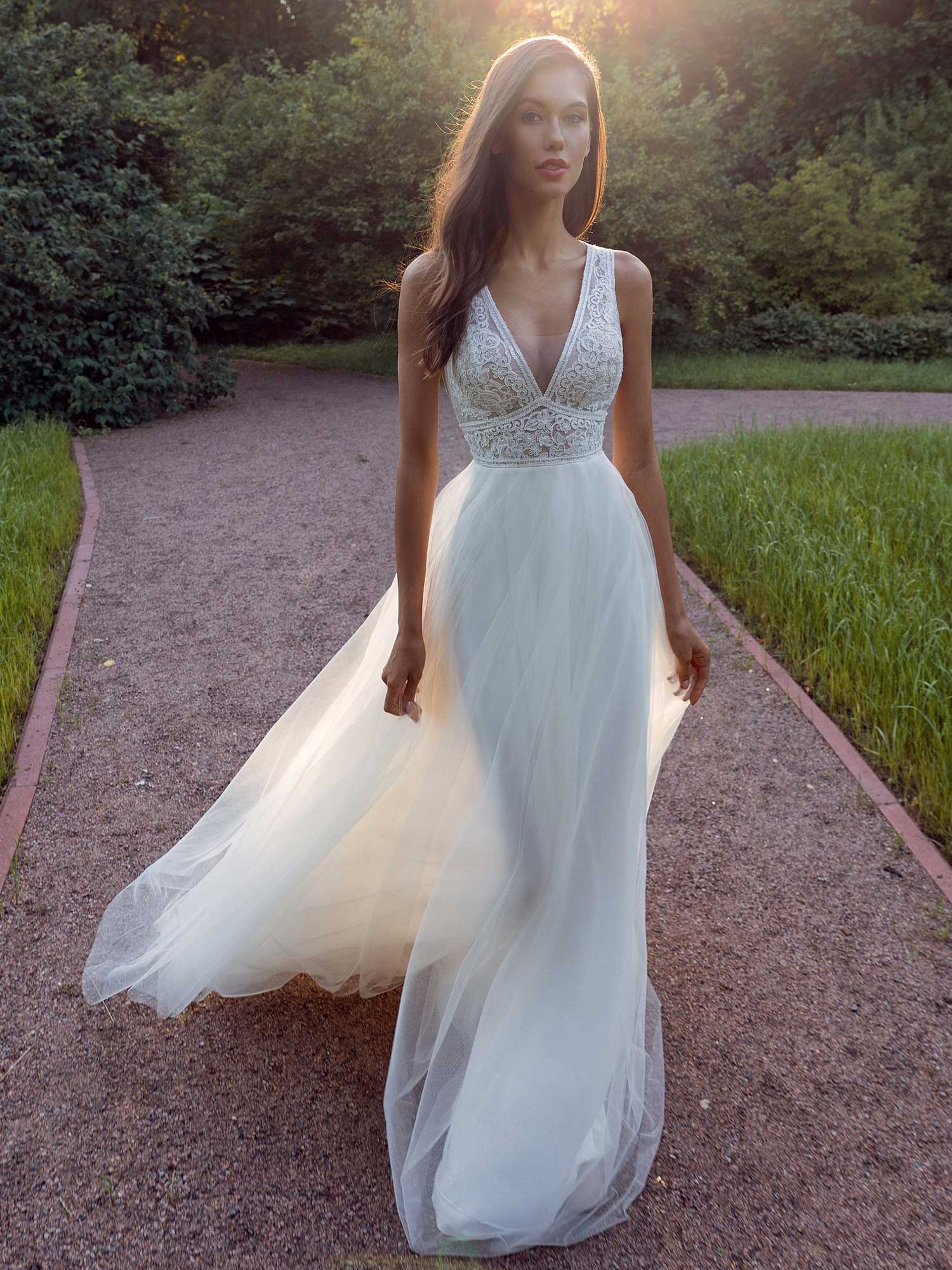 A Line Wedding Dress With A Deep V Neckline Lace Bodice And Illusion Back 