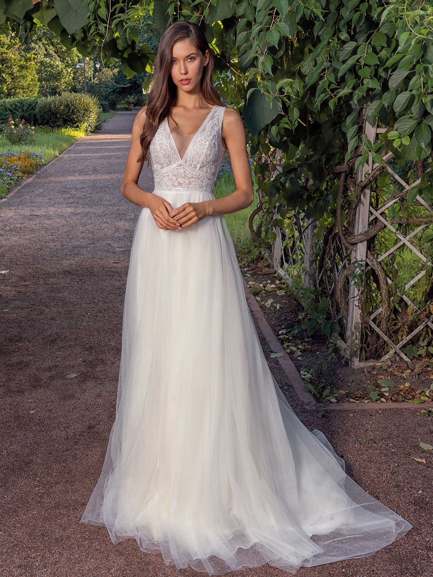 A line Wedding Dress With A Deep V neckline Lace Bodice And Illusion Back