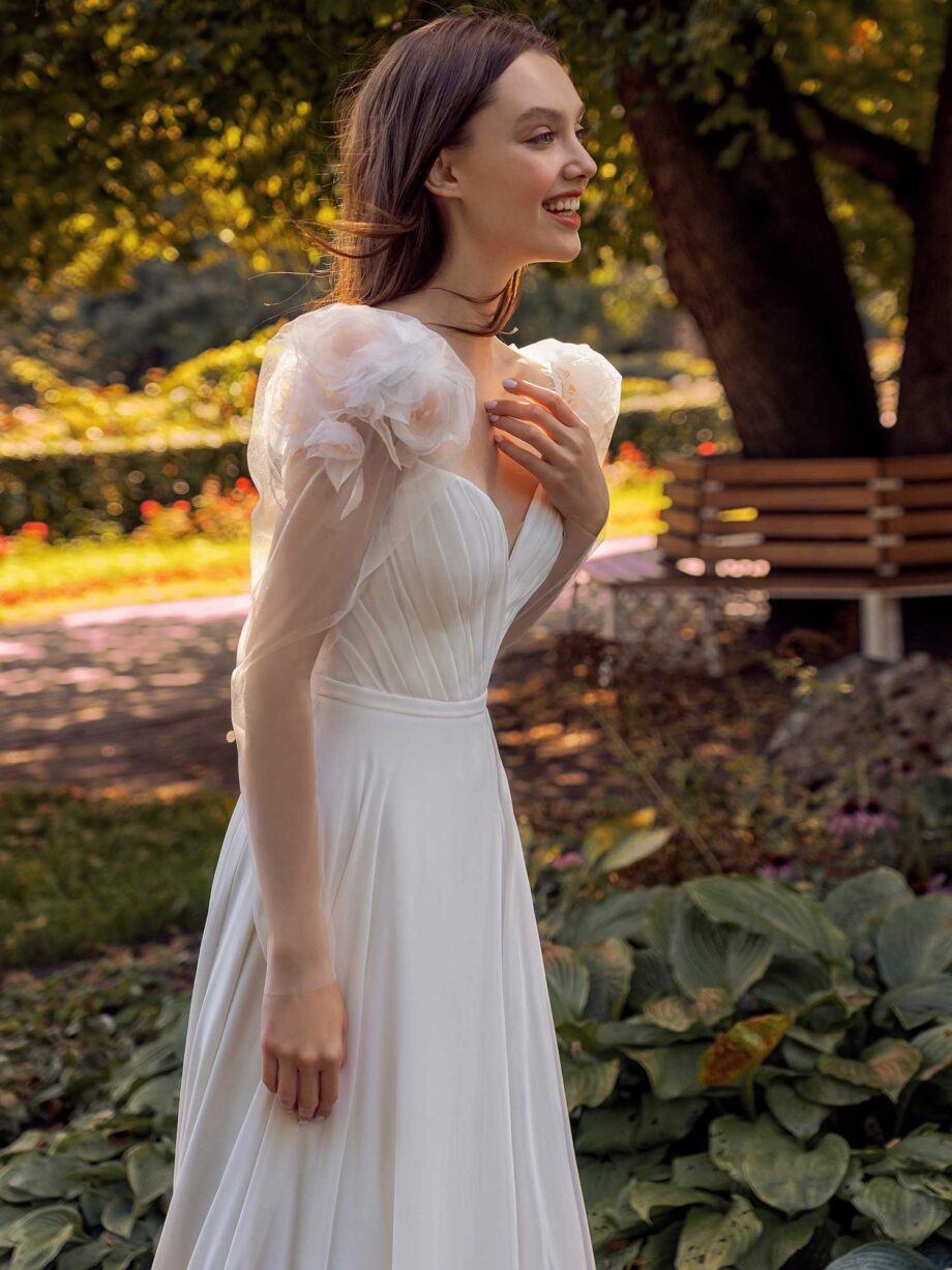 Long-sleeve sheath wedding dress with extended shoulders