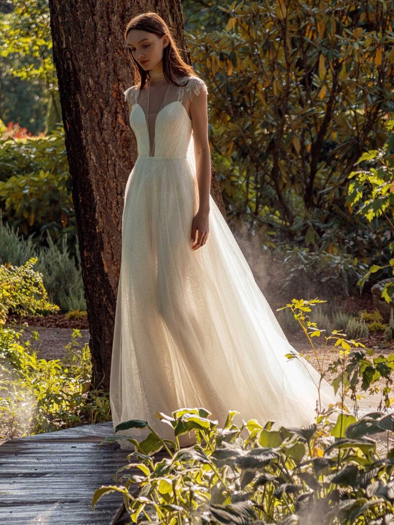 Shimmering lace A-line wedding dress with beaded shoulders