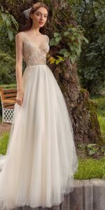 A line wedding dress with bustier style corset floral decor and pockets