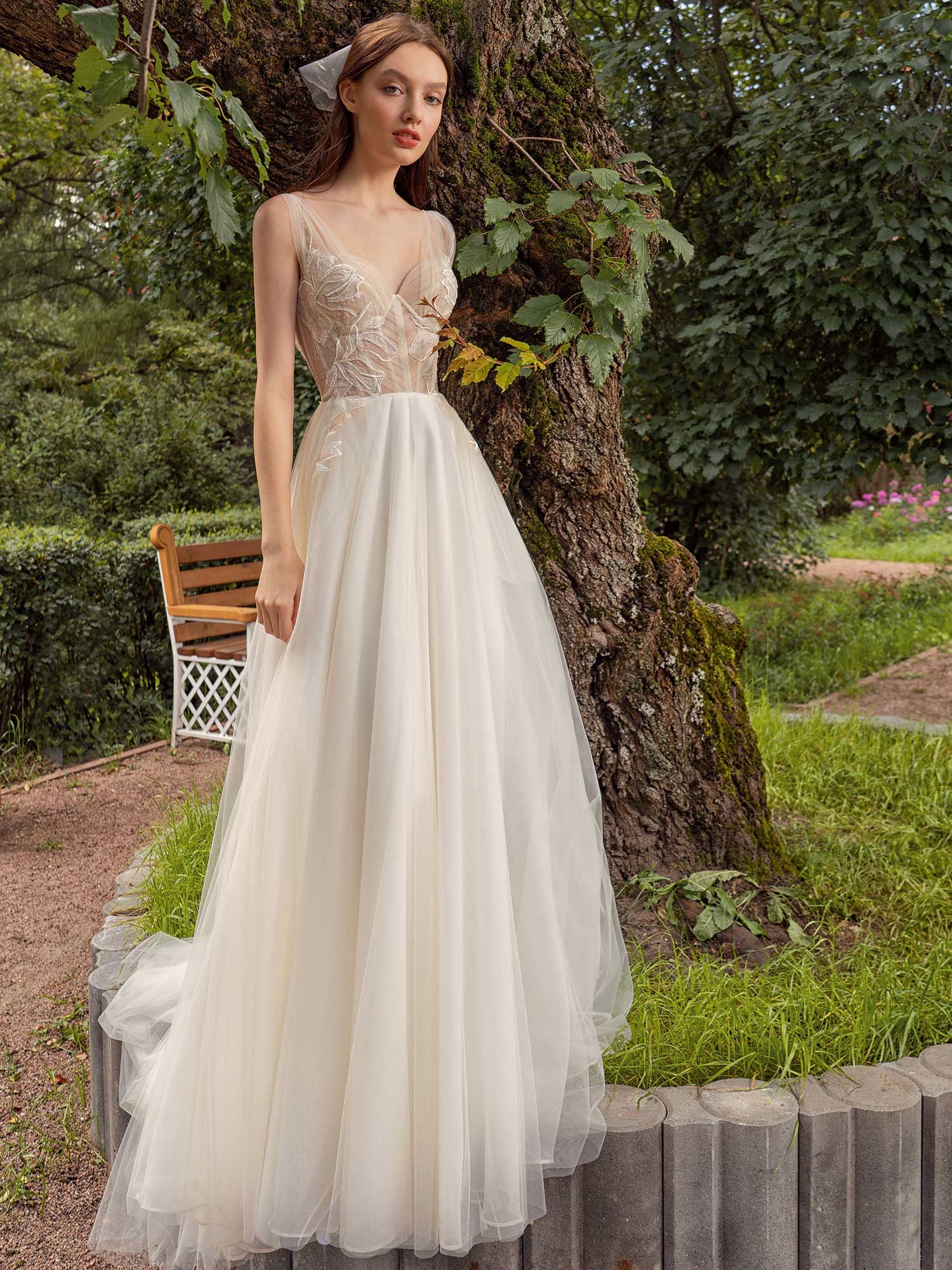 Wedding dress with bustier bodice and floral embroidery