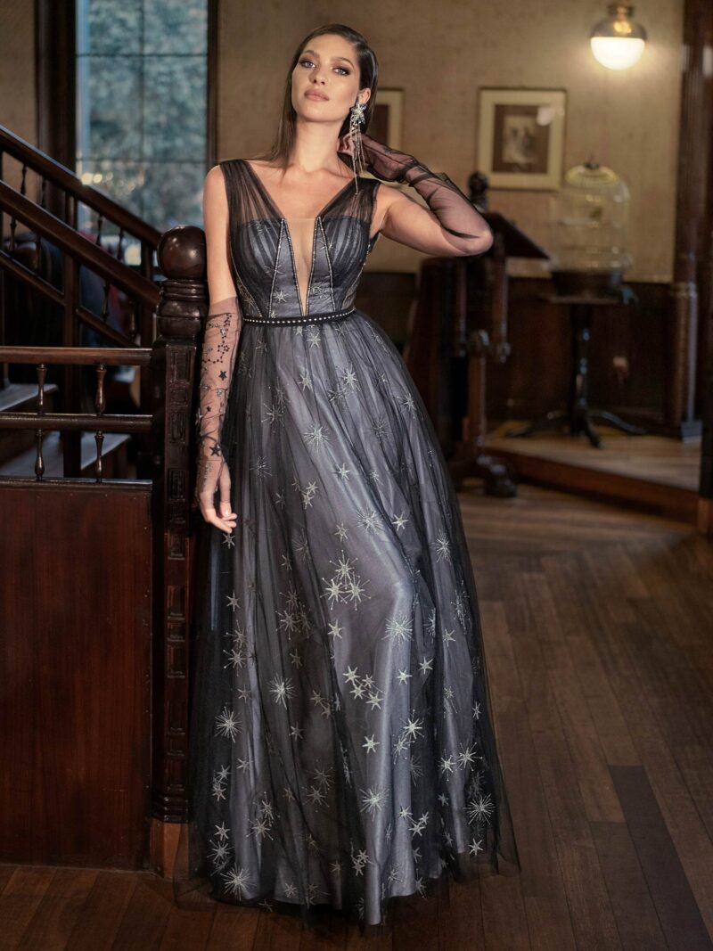Deep V-neckline evening gown with star embroidery