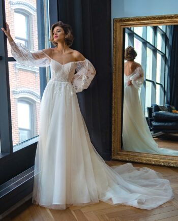 Ethereal A-line wedding dress with sheer embroidered sleeves, perfect for a modern bride. Available at Papilio Boutique bridal store Toronto.