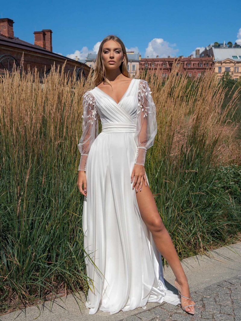 A-line wedding dress with long sleeves and skirt slit