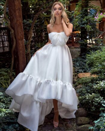 Strapless high-low wedding dress with bow decor and ruffles