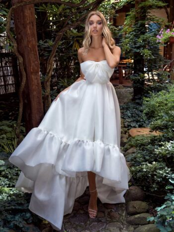 Strapless high-low wedding dress with bow decor and ruffles