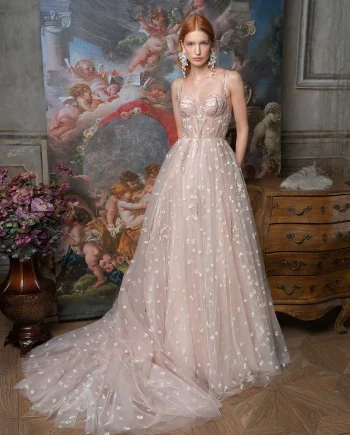 Full-length front view of a bride in a pink ballgown wedding dress; part of our sample sale Toronto with detailed floral applique.