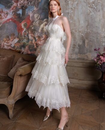 Tea-length A-line wedding dress with halter neck bodice and tiered skirt