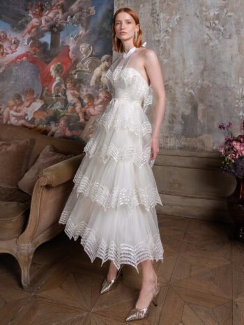 Tea-length A-line wedding dress with halter neck bodice and tiered skirt