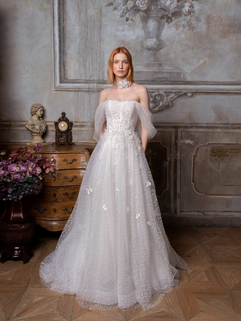 Shimmering tulle ballgown wedding dress with off-the-shoulder straps