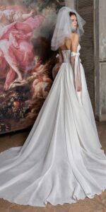 Mini wedding dress with detachable sleeves and overskirt