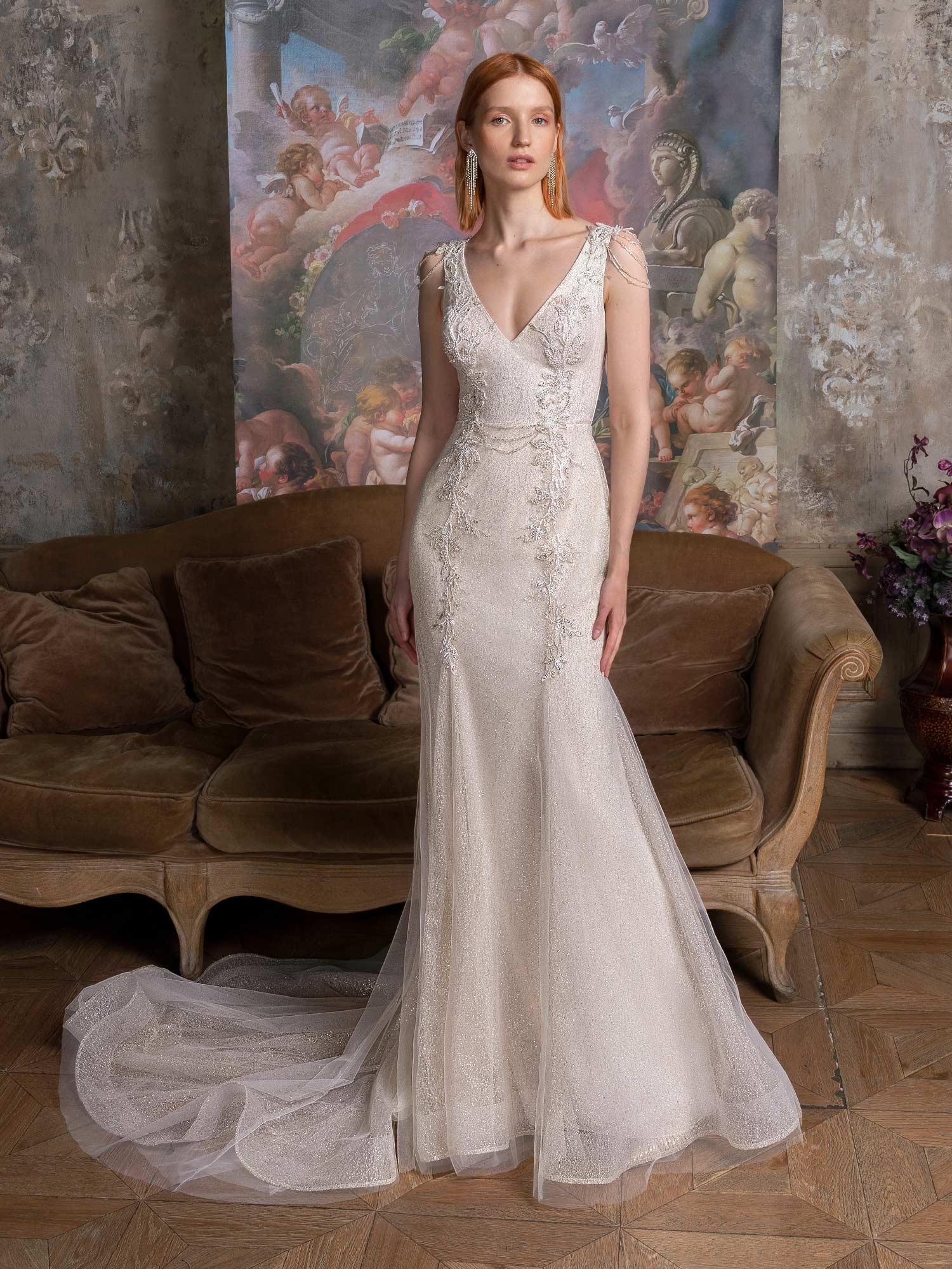 Long-sleeve sheath wedding dress with bustier style corset
