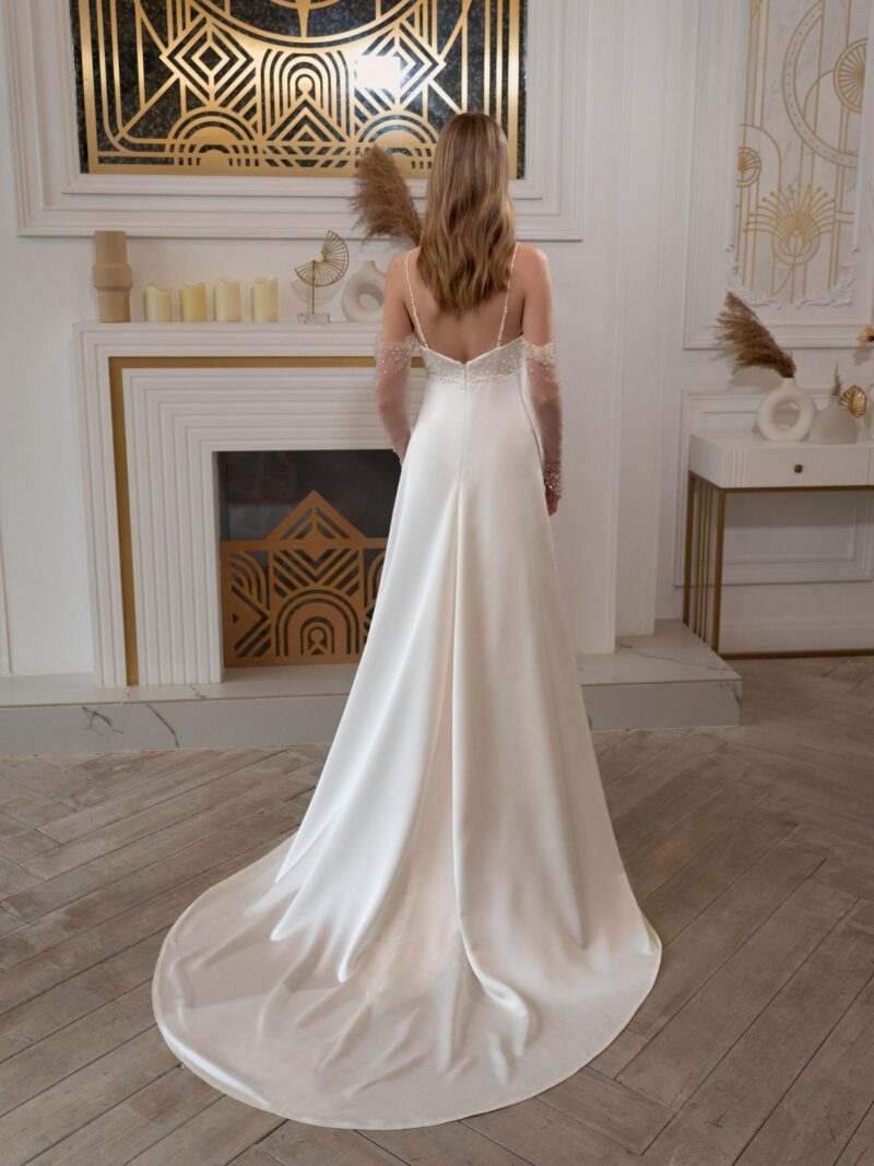 Sheath wedding gown with long off-the-shoulder sleeves