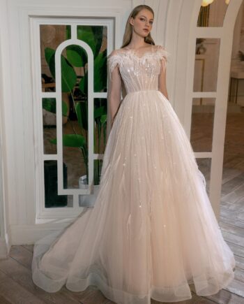 Peach ball gown wedding dress with feathers and beads