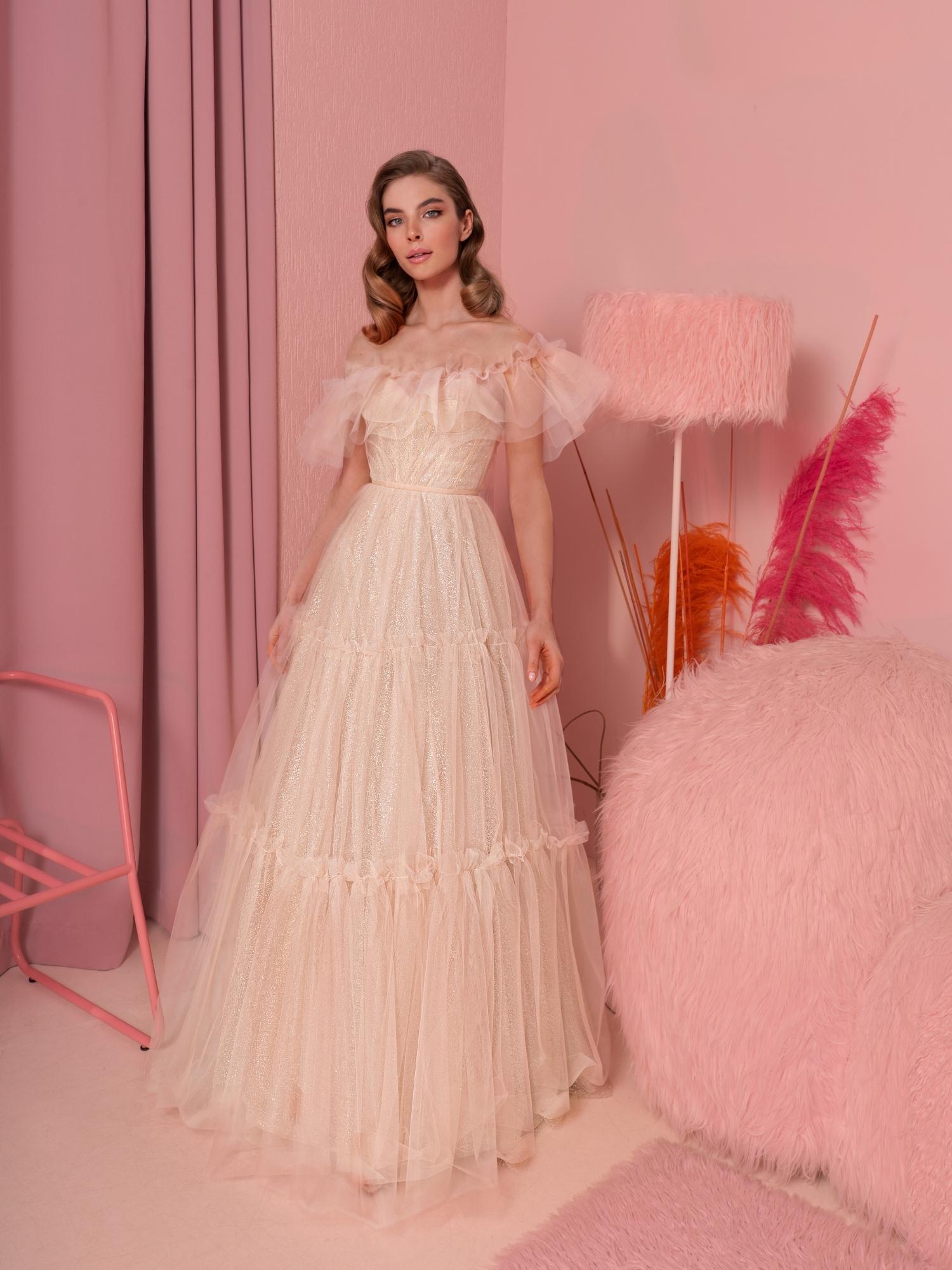Ballgown with ruffled off-the-shoulder neckline and tiered skirt