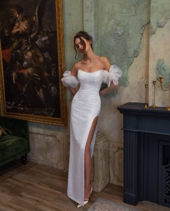 Sheath wedding dress with a thigh-high slit and long sleeves