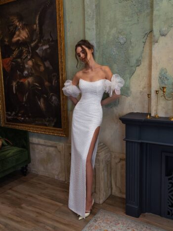 Sheath wedding dress with a thigh-high slit and long sleeves