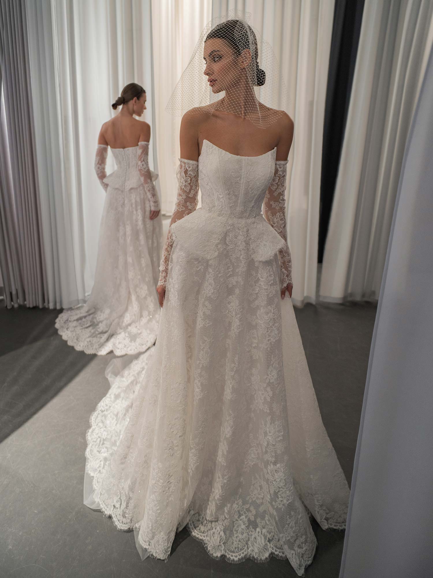 lace A-line wedding dress with basque waist and detachable sleeves, photographed at Papilio Boutique Toronto, bridal stores in Toronto